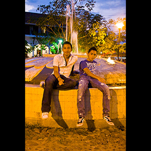 Two Boys on the Fountain in the Square in Suchitoto